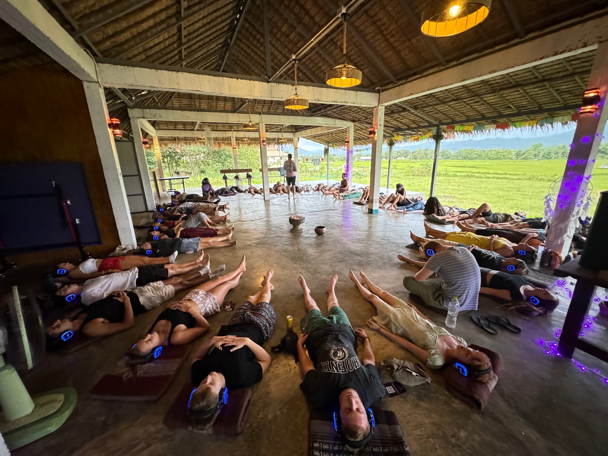 Mind Artists hypnosis workshop. A roomful of women lying down, eyes closed, in a guided trance state.
